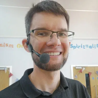 A photo of Rob Humphrey wearing a headset microphone.