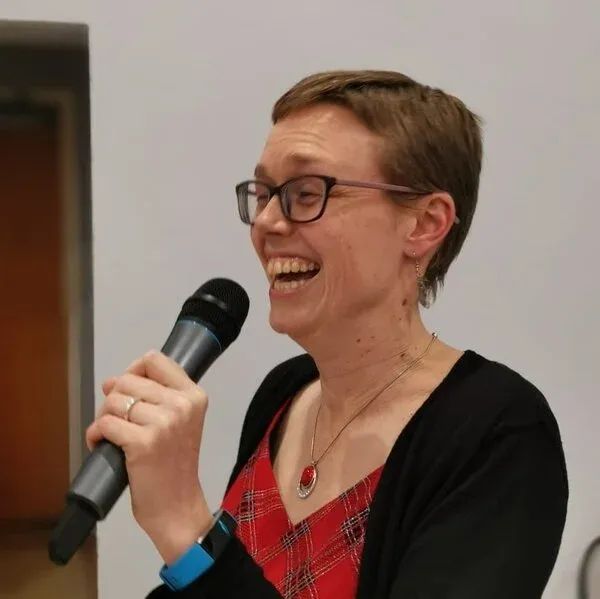 Nicola Scott, laughing with a microphone