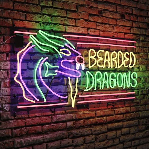 A neon sign reading Bearded Dragons and showing a dragon with a beard, on a brick wall